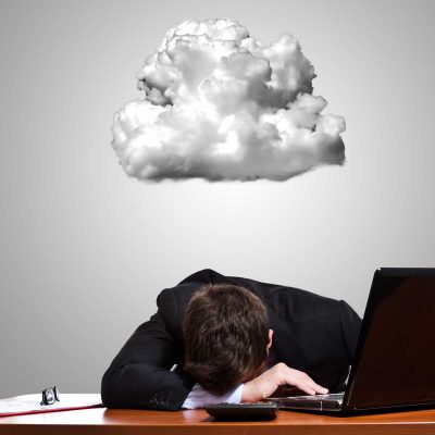 Businessman depressed about cloud failure
