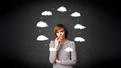 Woman thinking about cloud options Woman thinking about cloud options
