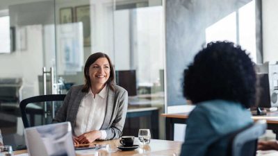Two women meeting about IT issues Two women meeting about IT issues